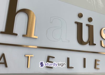 Haus Atelier 3d acrylic signage with pvd coated stainless steel overlay